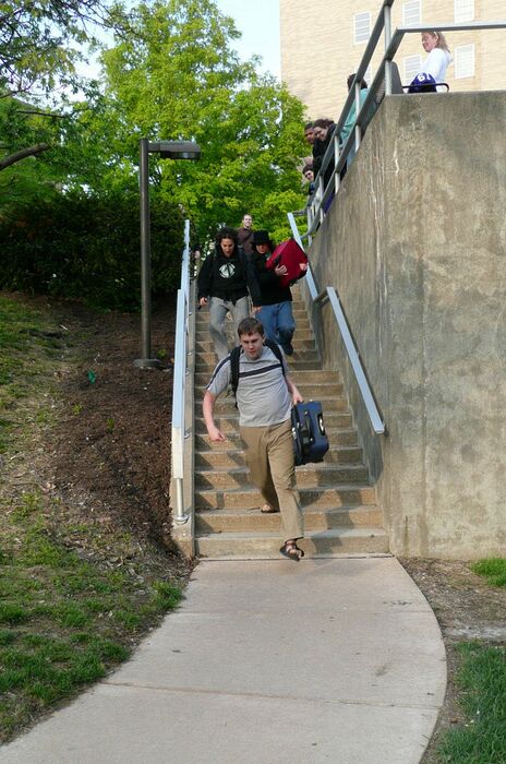 Jonathan Pecht, Sandra Sieben and Jonathan Minelli are cheered as they start down the first set of stairs.  Our hilly campus made a great simulation of a train station's ups and downs.